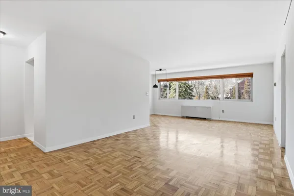 a view of an empty room with a window