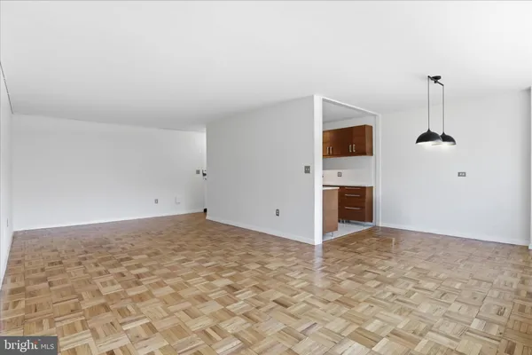 a view of empty room with fireplace and window