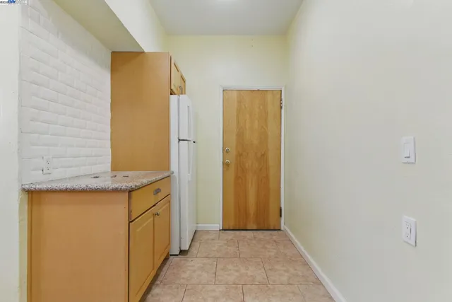 a view of a kitchen from the hallway