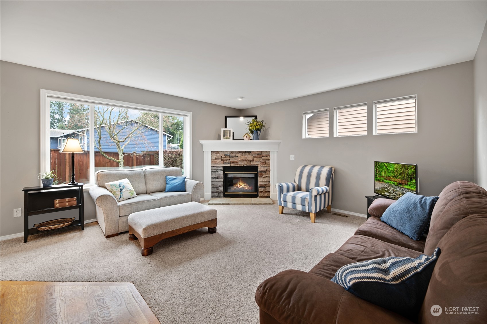 3108 191st Street Southeast Bothell, WA 98012 - Photo 8 of 31 a living room with furniture and a fireplace