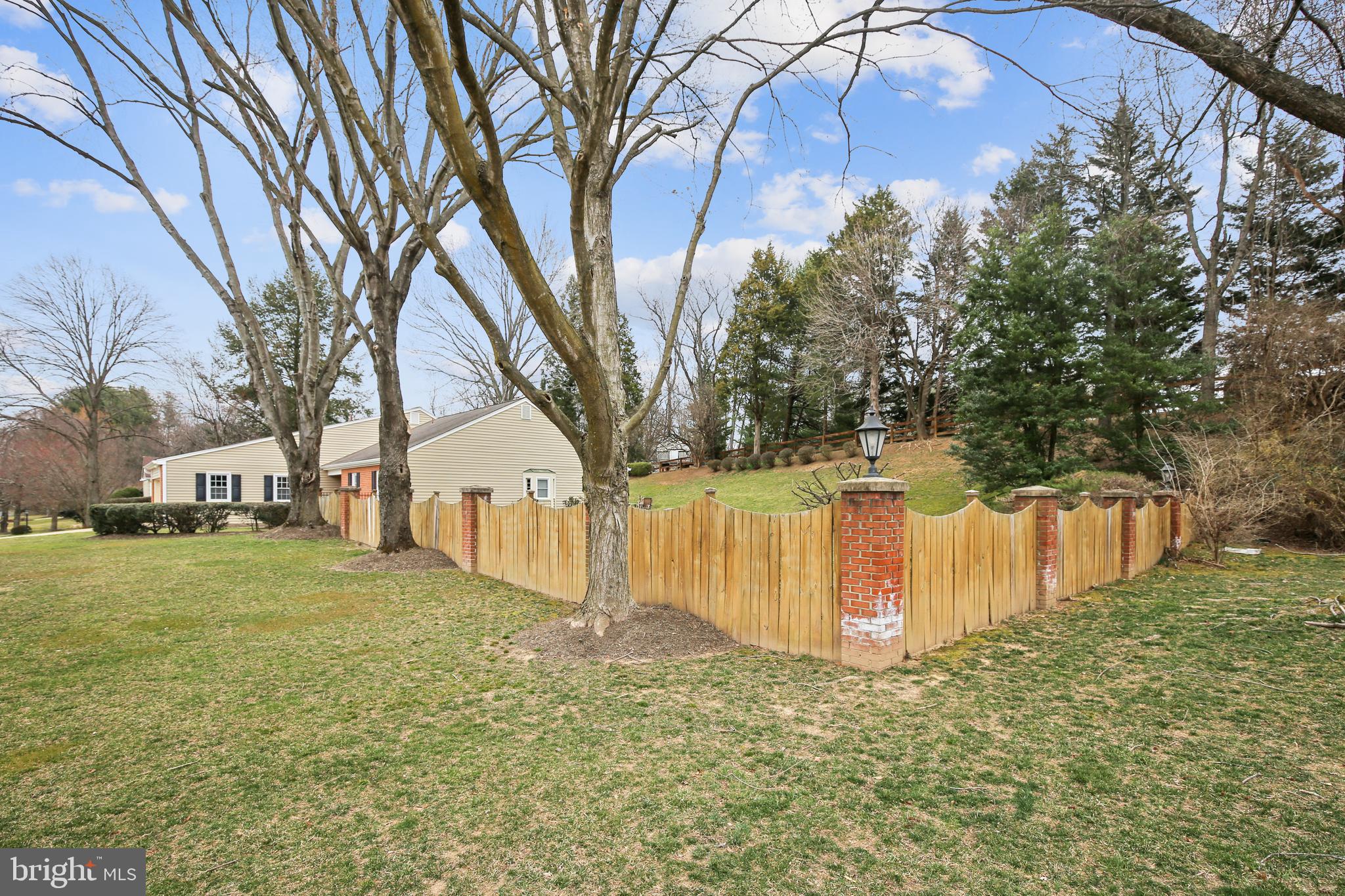 1923 Batten Hollow Road Vienna, VA 22182 - Photo 33 of 37 Charming fencing with lanterns atop brick columns