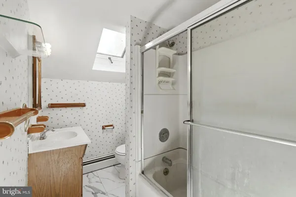 a bathroom with a sink and shower