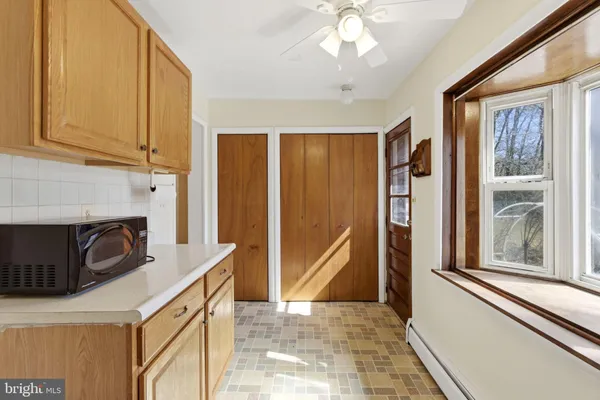 a kitchen with stainless steel appliances granite countertop a refrigerator a stove and a sink with cabinets