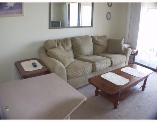 3938 Surfside, Unit 3241 Corpus Christi, TX 78402 - Photo 3 of 8 a living room with furniture and a couch