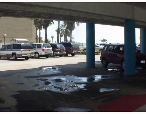 3938 Surfside, Unit 3241 Corpus Christi, TX 78402 - Photo 8 of 8 a living room with furniture and a floor to ceiling window
