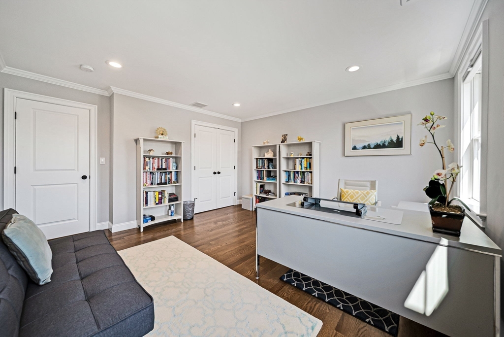 17 Sunrise Terrace Needham, MA 02492 - Photo 23 of 42 a living room with furniture and a flat screen tv