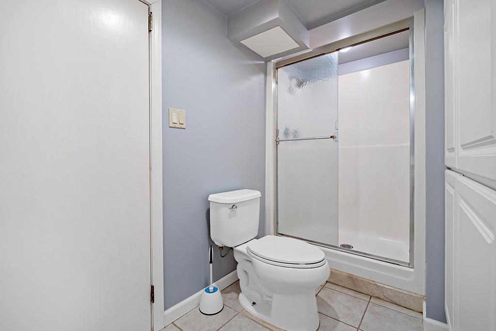 2839 Reiter Road Pittsburgh, PA 15235 - Photo 20 of 25 a white toilet sitting next to a shower