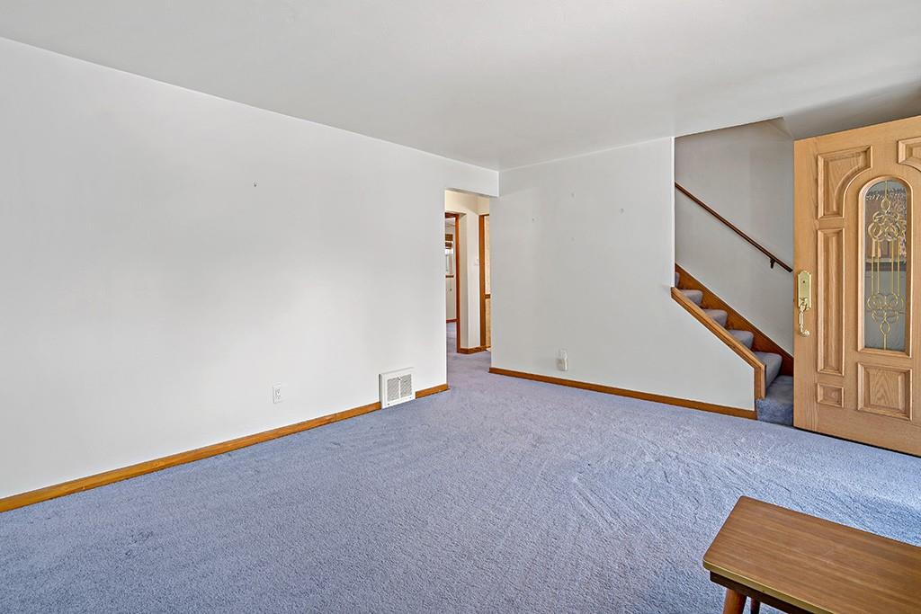 2839 Reiter Road Pittsburgh, PA 15235 - Photo 3 of 25 an empty room with wooden floor and windows