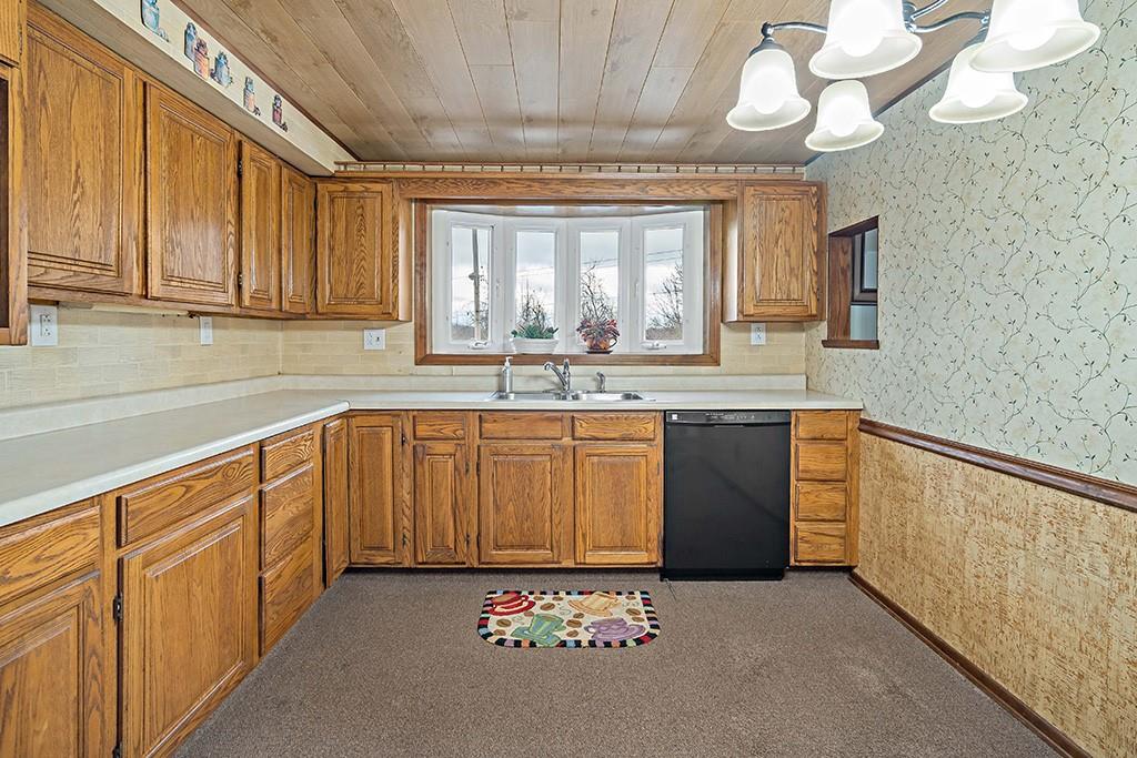 2839 Reiter Road Pittsburgh, PA 15235 - Photo 7 of 25 a kitchen with cabinets a sink and a stove