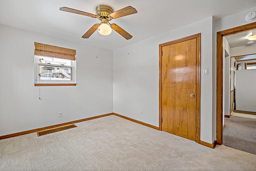 2839 Reiter Road Pittsburgh, PA 15235 - Photo 9 of 25 an empty room with windows and fan