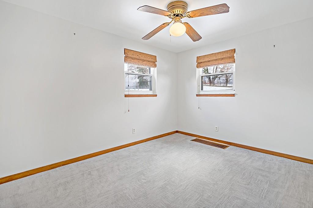 2839 Reiter Road Pittsburgh, PA 15235 - Photo 10 of 25 an empty room with windows and fan