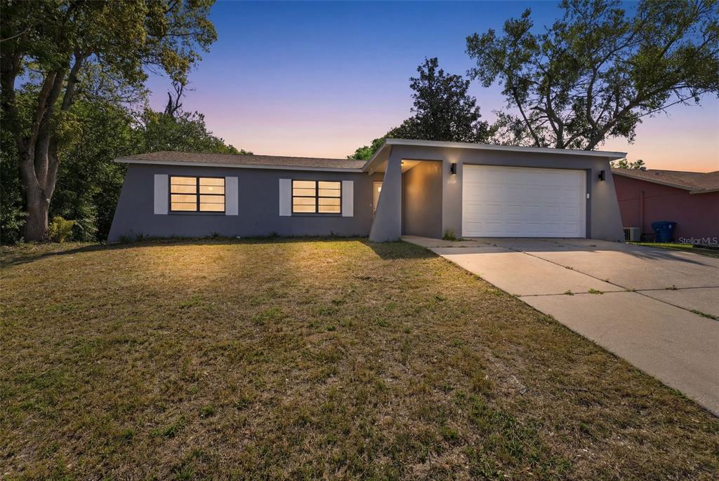 a view of a house with a yard