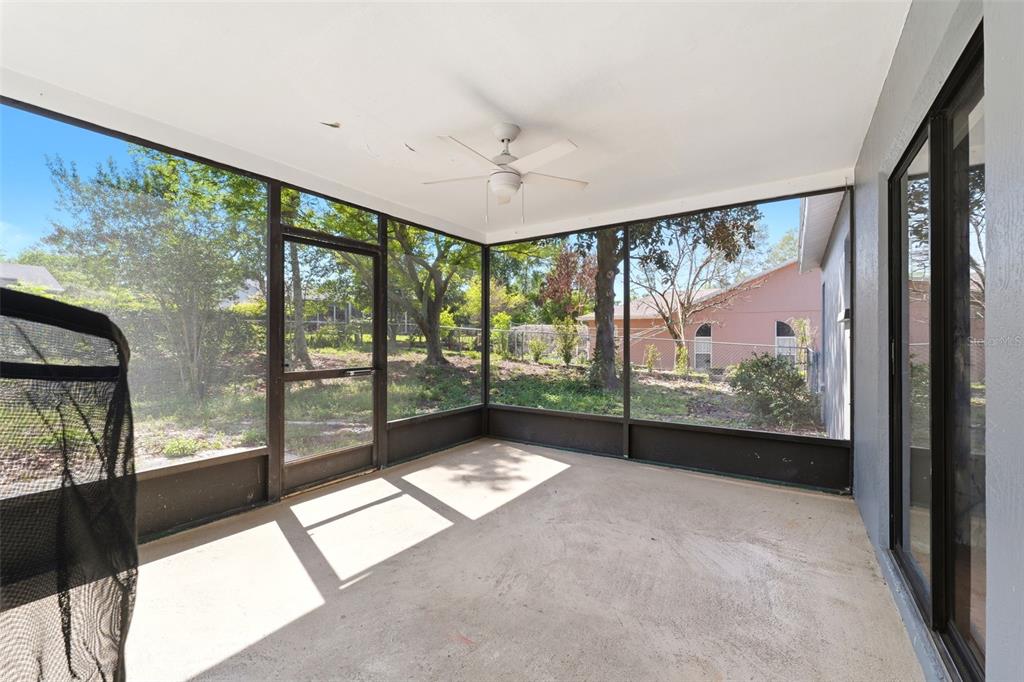 5364 Deltona Boulevard Spring Hill, FL 34606 - Photo 20 of 33 a view of an empty room with windows