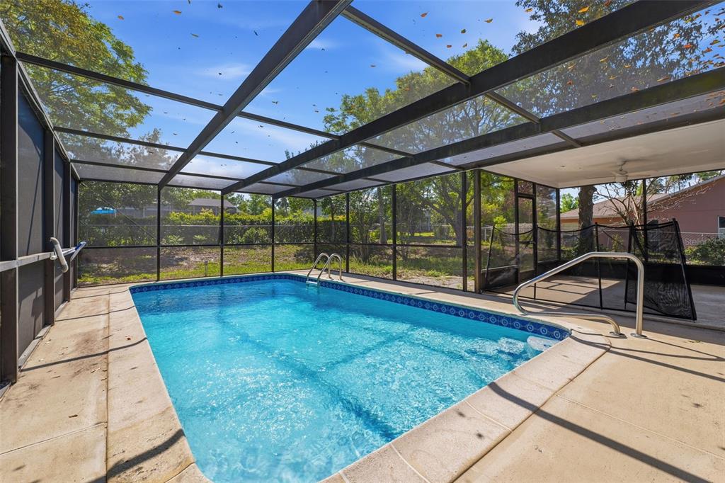 5364 Deltona Boulevard Spring Hill, FL 34606 - Photo 23 of 33 a view of a swimming pool with a porch