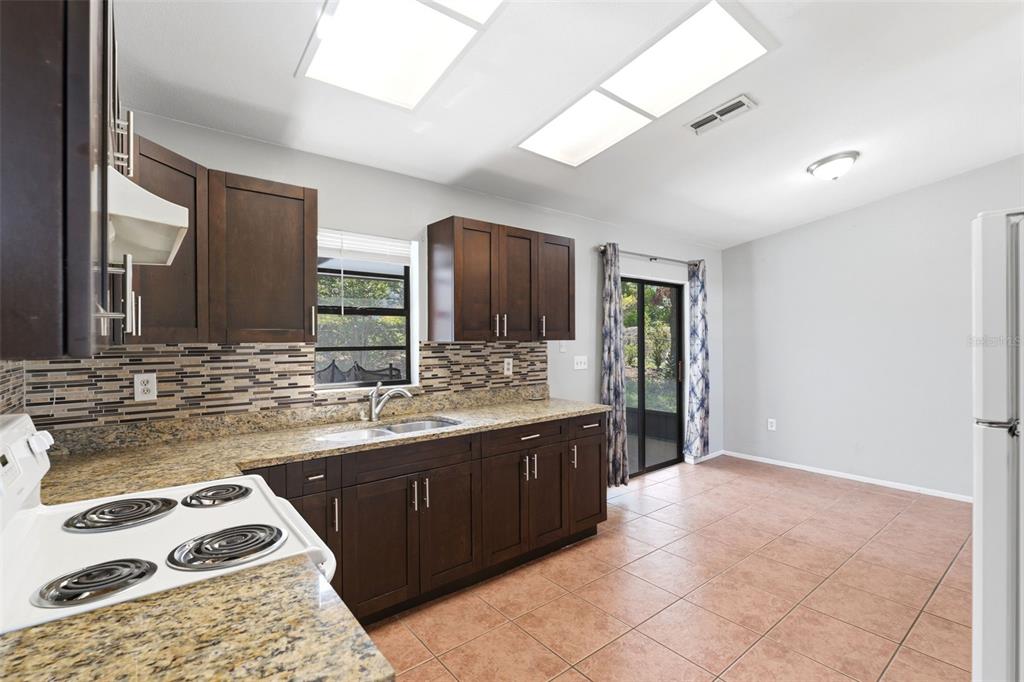 5364 Deltona Boulevard Spring Hill, FL 34606 - Photo 32 of 33 a large bathroom with a sink and a large mirror