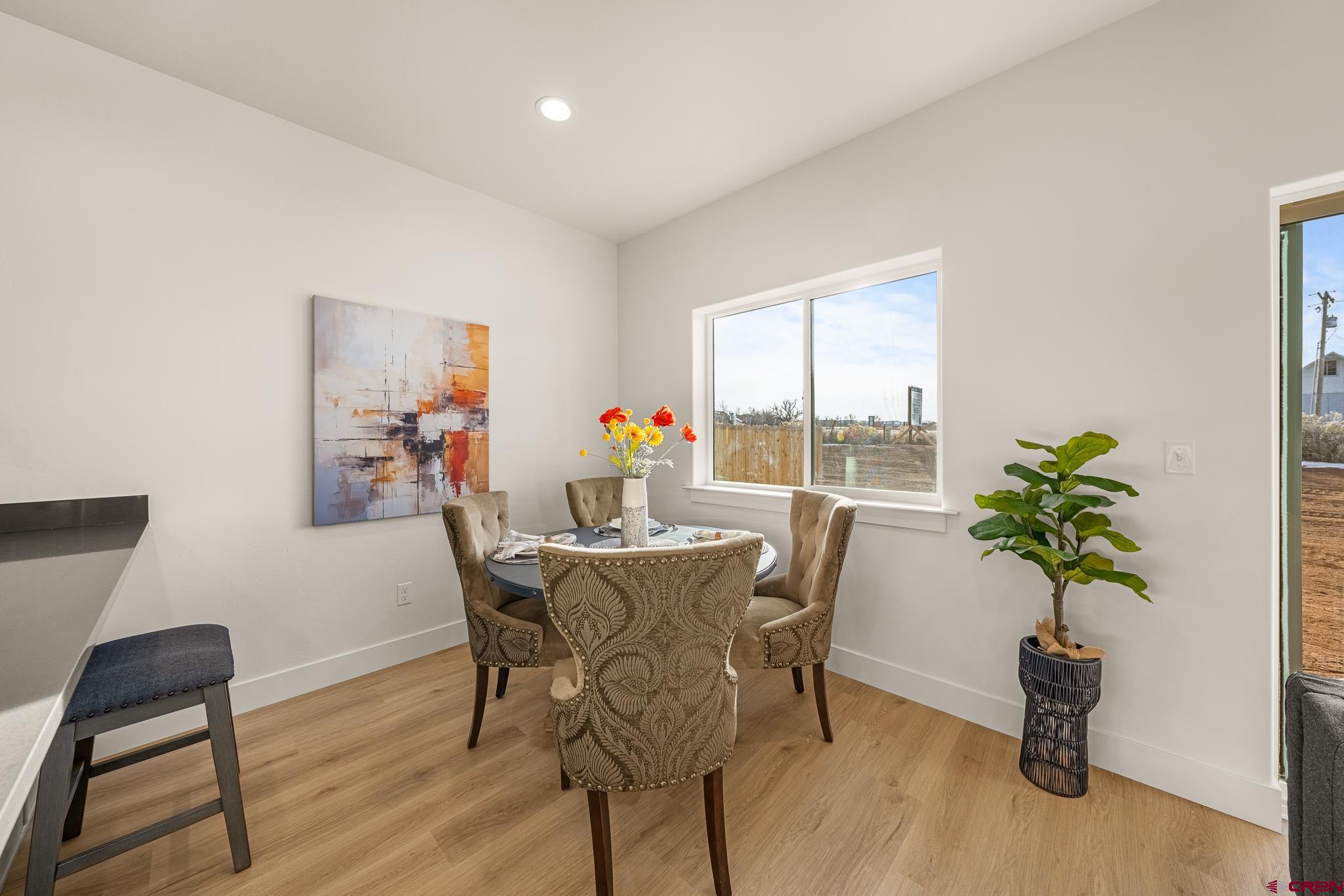 116 Senica Street Bayfield, CO 81122 - Photo 11 of 28 a view of a dining room with furniture window and wooden floor