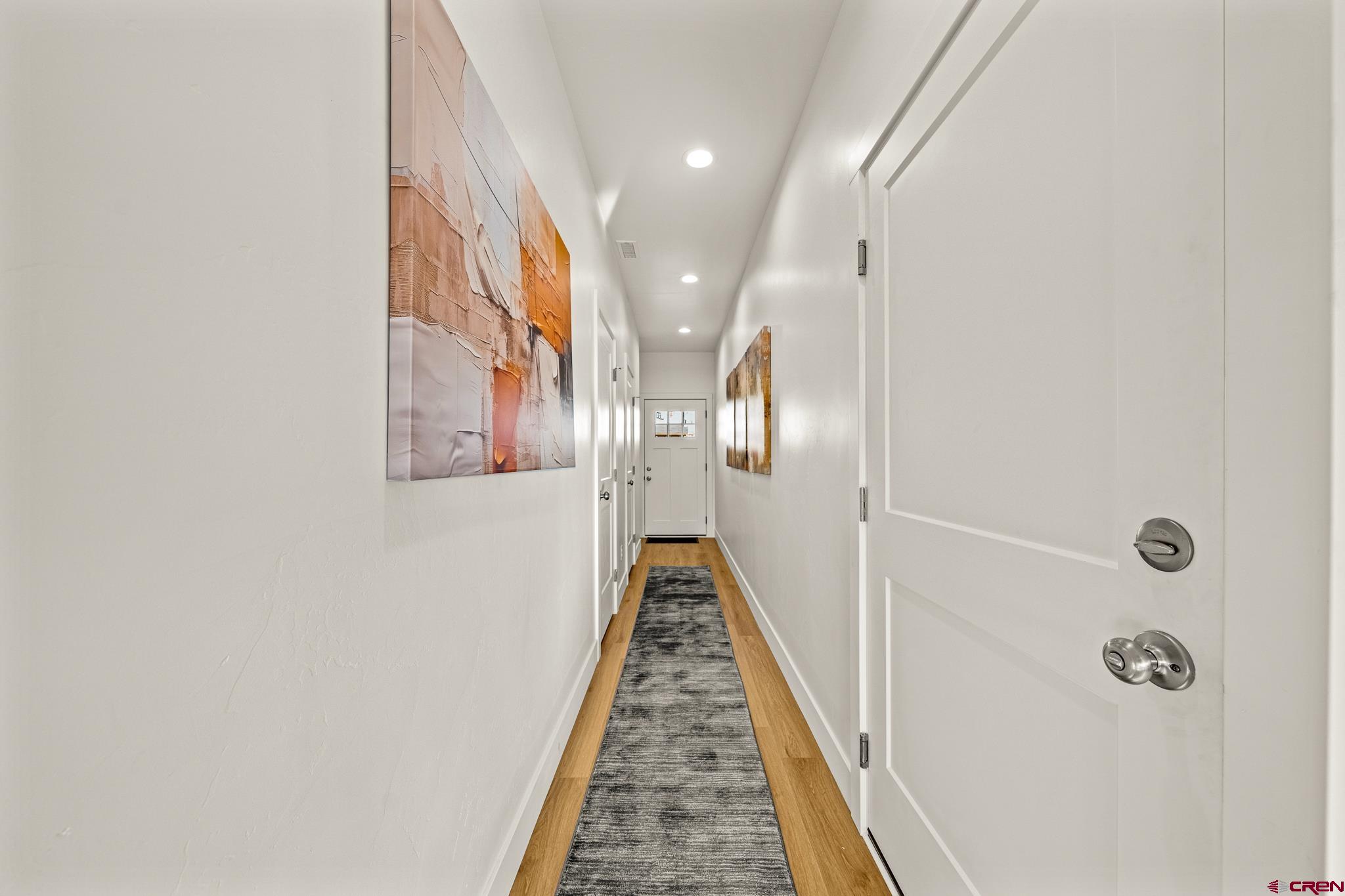 116 Senica Street Bayfield, CO 81122 - Photo 17 of 28 a view of a hallway with wooden floor and staircase