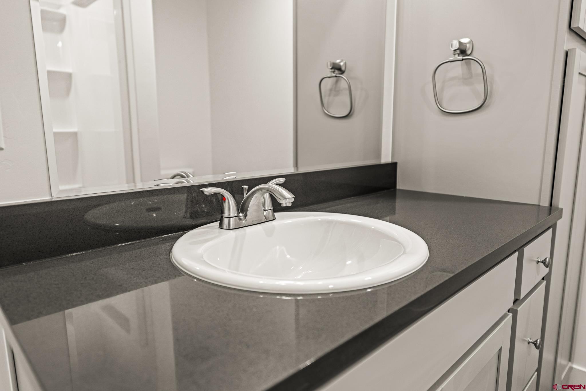 116 Senica Street Bayfield, CO 81122 - Photo 28 of 28 a bathroom with a sink and mirror