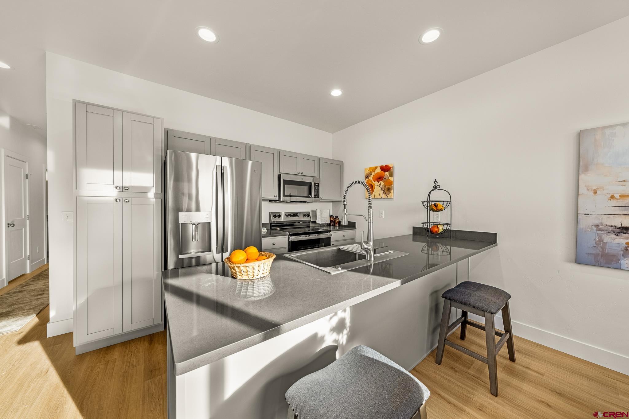 116 Senica Street Bayfield, CO 81122 - Photo 6 of 28 a kitchen with a sink appliances and cabinets