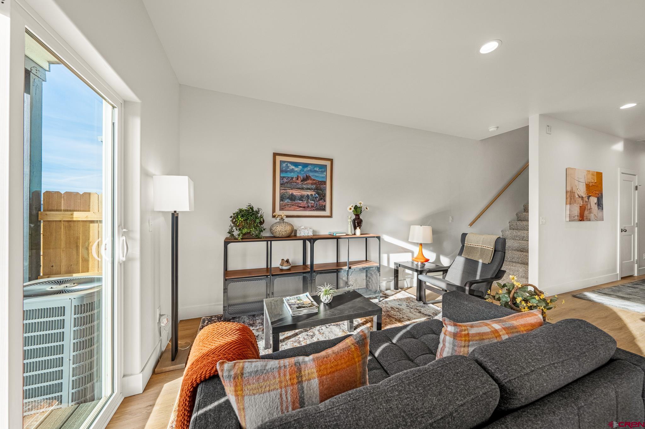 116 Senica Street Bayfield, CO 81122 - Photo 9 of 28 a living room with furniture a flat screen tv and a large window