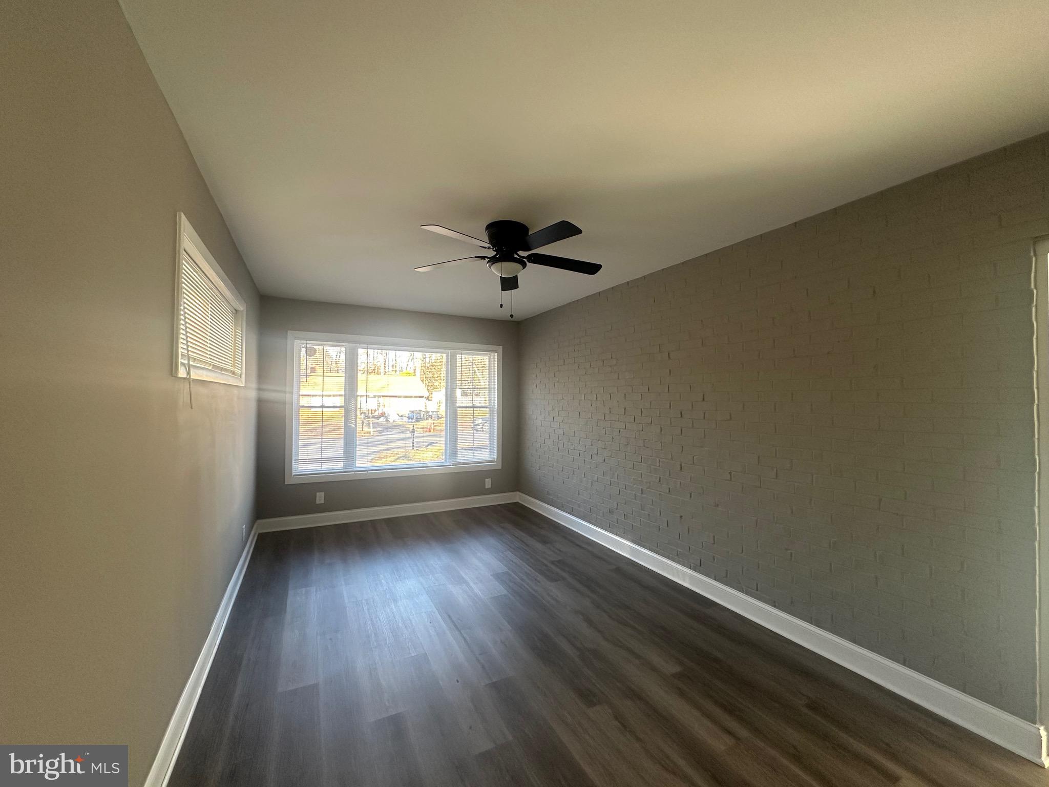 1401 Madison Drive Fort Washington, MD 20744 - Photo 11 of 30 wooden floor in an empty room with a window