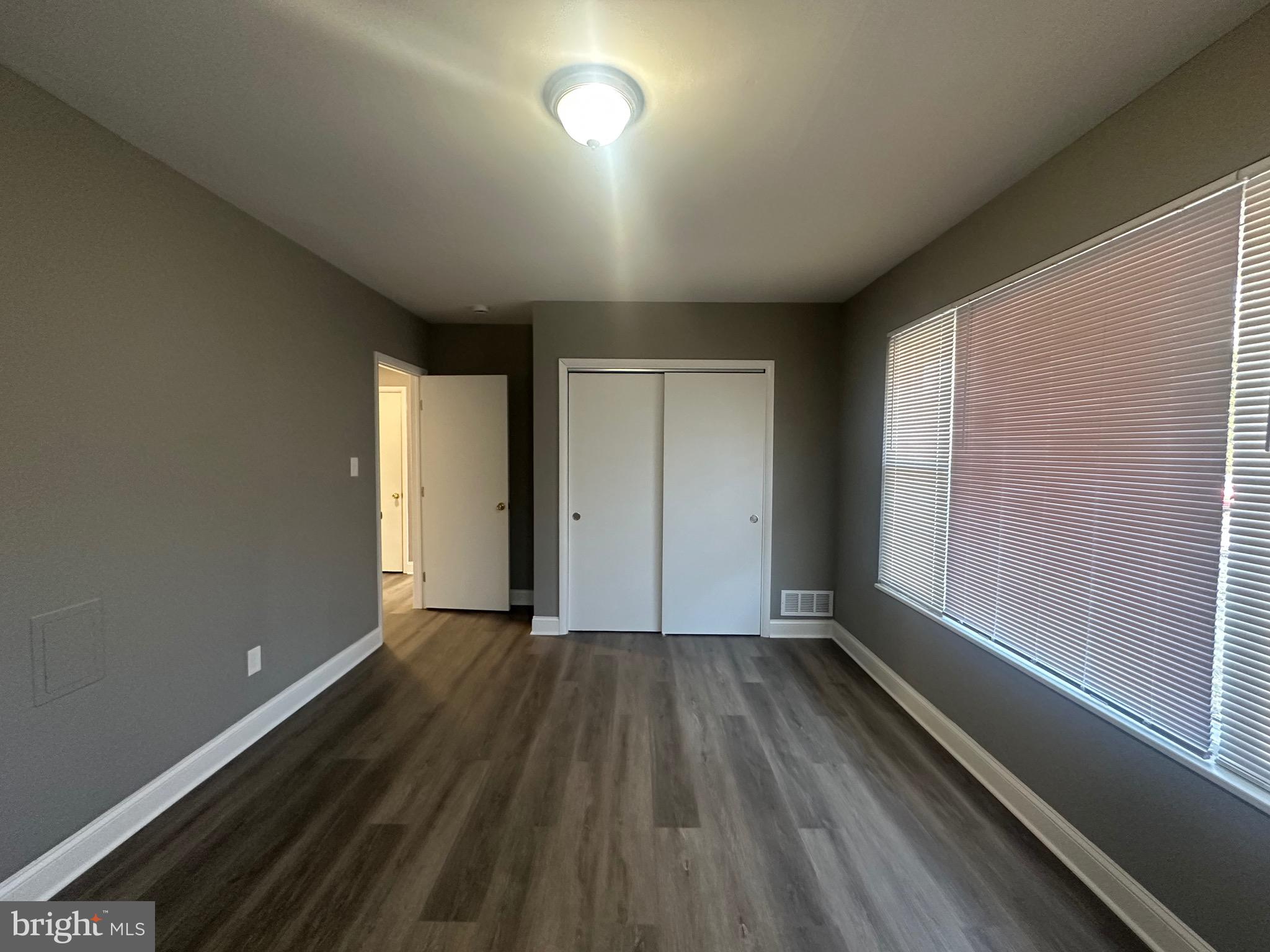1401 Madison Drive Fort Washington, MD 20744 - Photo 17 of 30 an empty room with wooden floor and windows