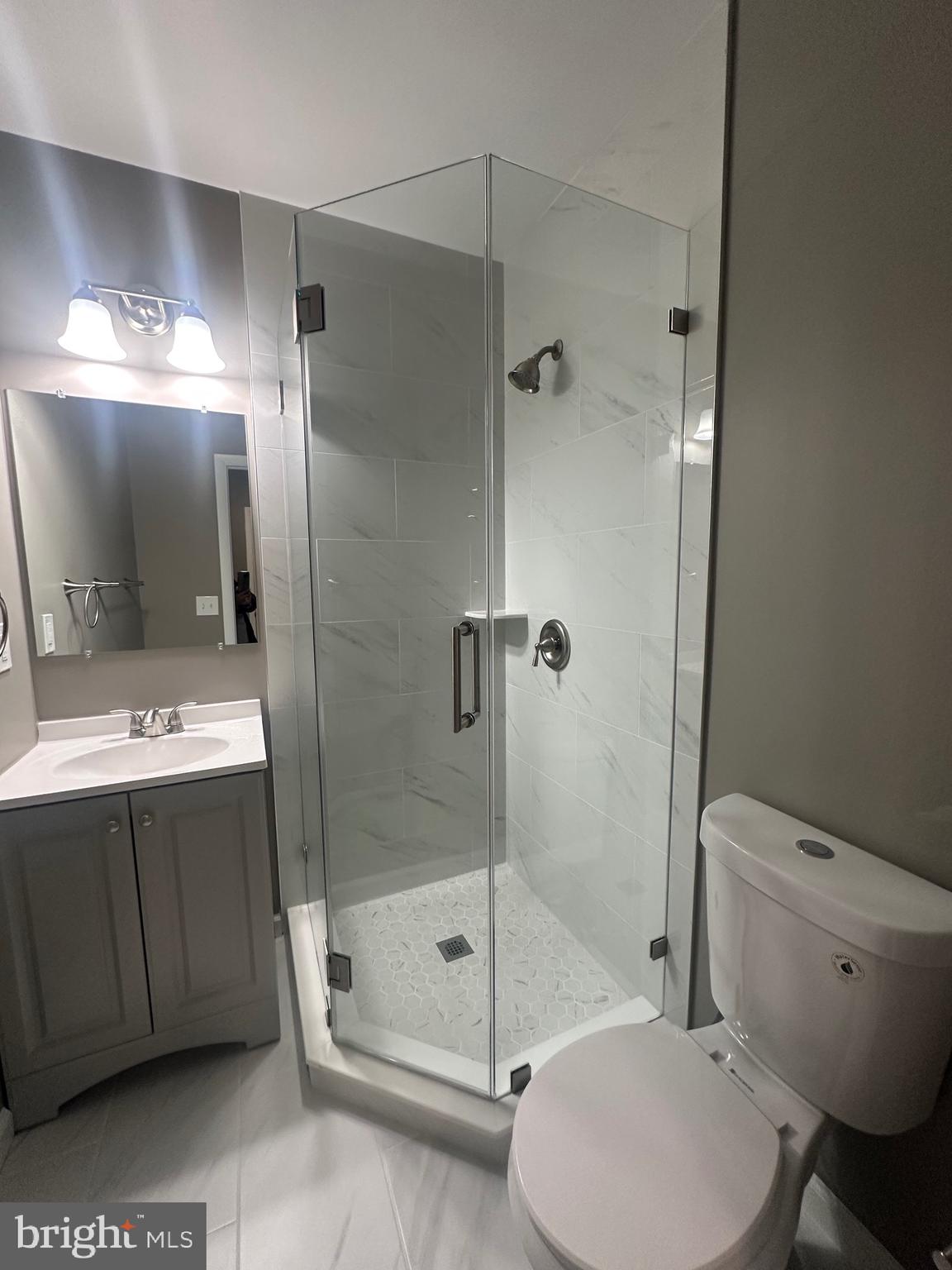 1401 Madison Drive Fort Washington, MD 20744 - Photo 19 of 30 a bathroom with a sink toilet and shower