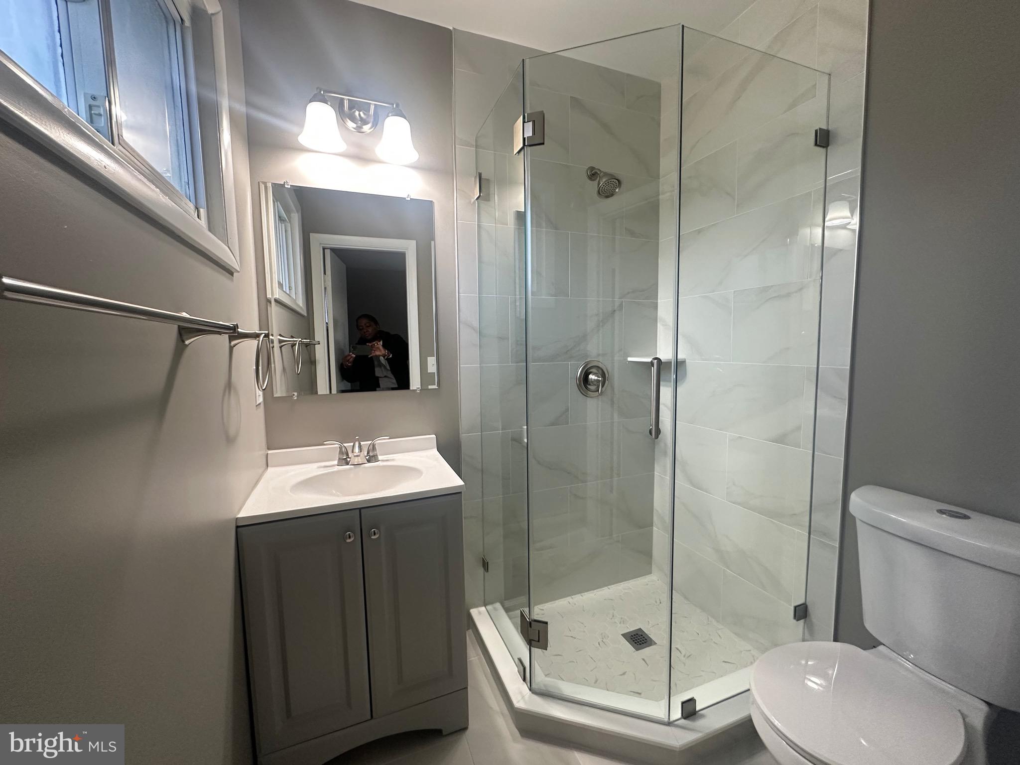 1401 Madison Drive Fort Washington, MD 20744 - Photo 21 of 30 a bathroom with a shower and a toilet