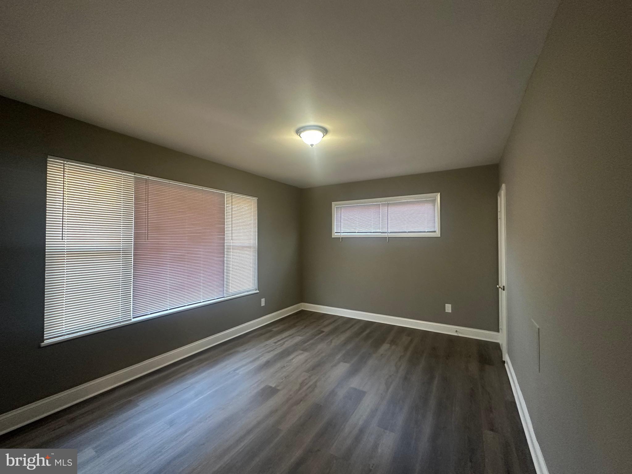 1401 Madison Drive Fort Washington, MD 20744 - Photo 24 of 30 an empty room with wooden floor and windows