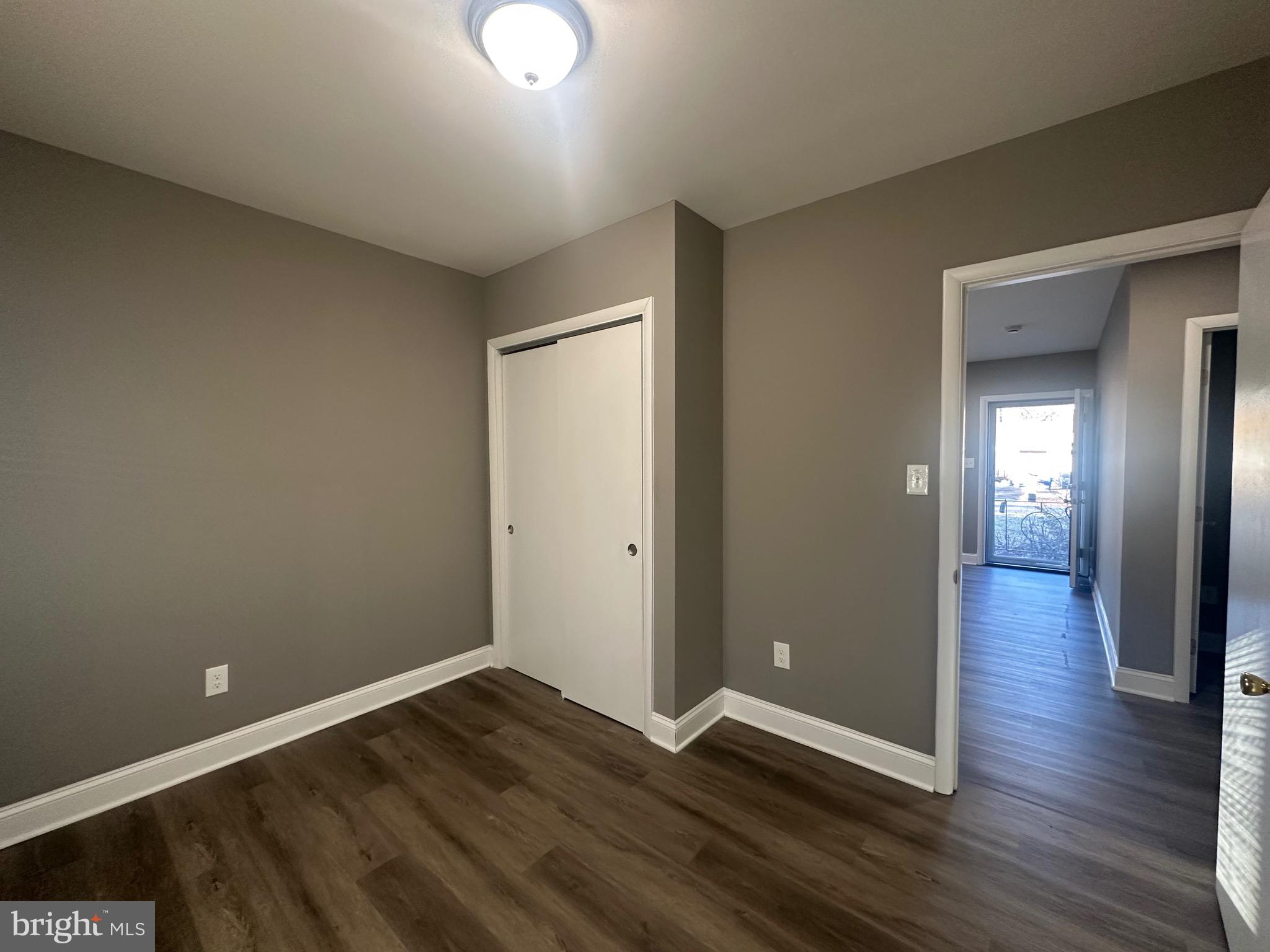 1401 Madison Drive Fort Washington, MD 20744 - Photo 27 of 30 a view of an empty room with wooden floor