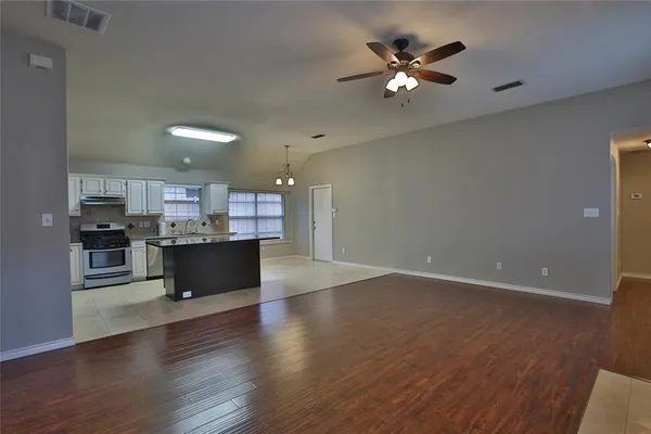 a view of kitchen with wooden floor and window