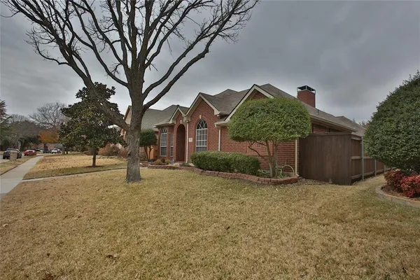 a house with a tree in front of it