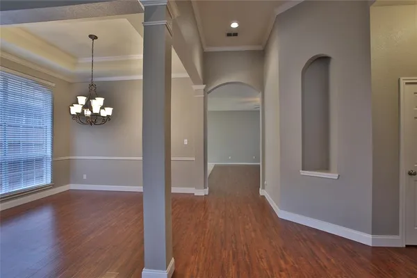 a view of a livingroom with wooden floor