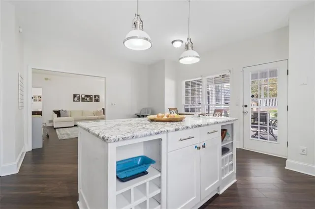 a kitchen with stainless steel appliances granite countertop a stove and cabinets