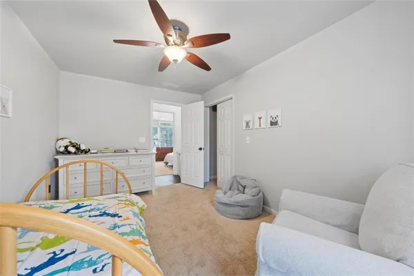 a bedroom with furniture and a wooden floor