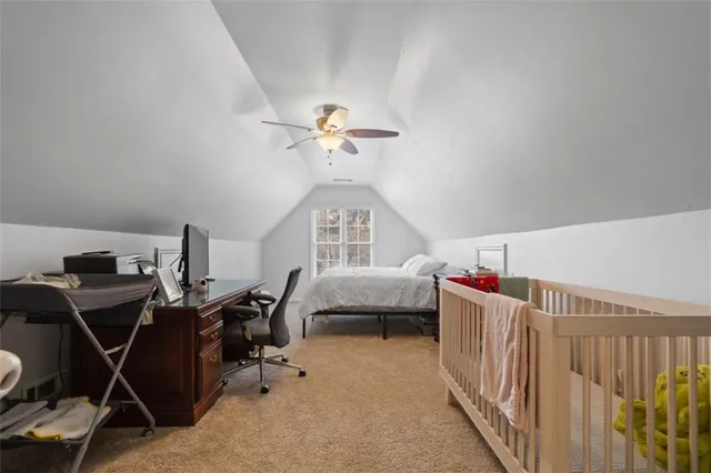 a living room with furniture a air conditioner vent and a window