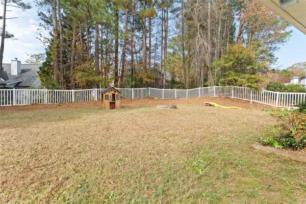 a swimming pool with wooden fence