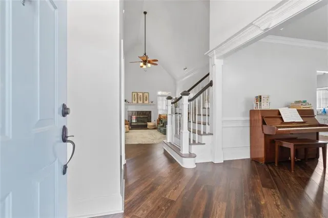 a view of a livingroom with furniture and hardwood floor
