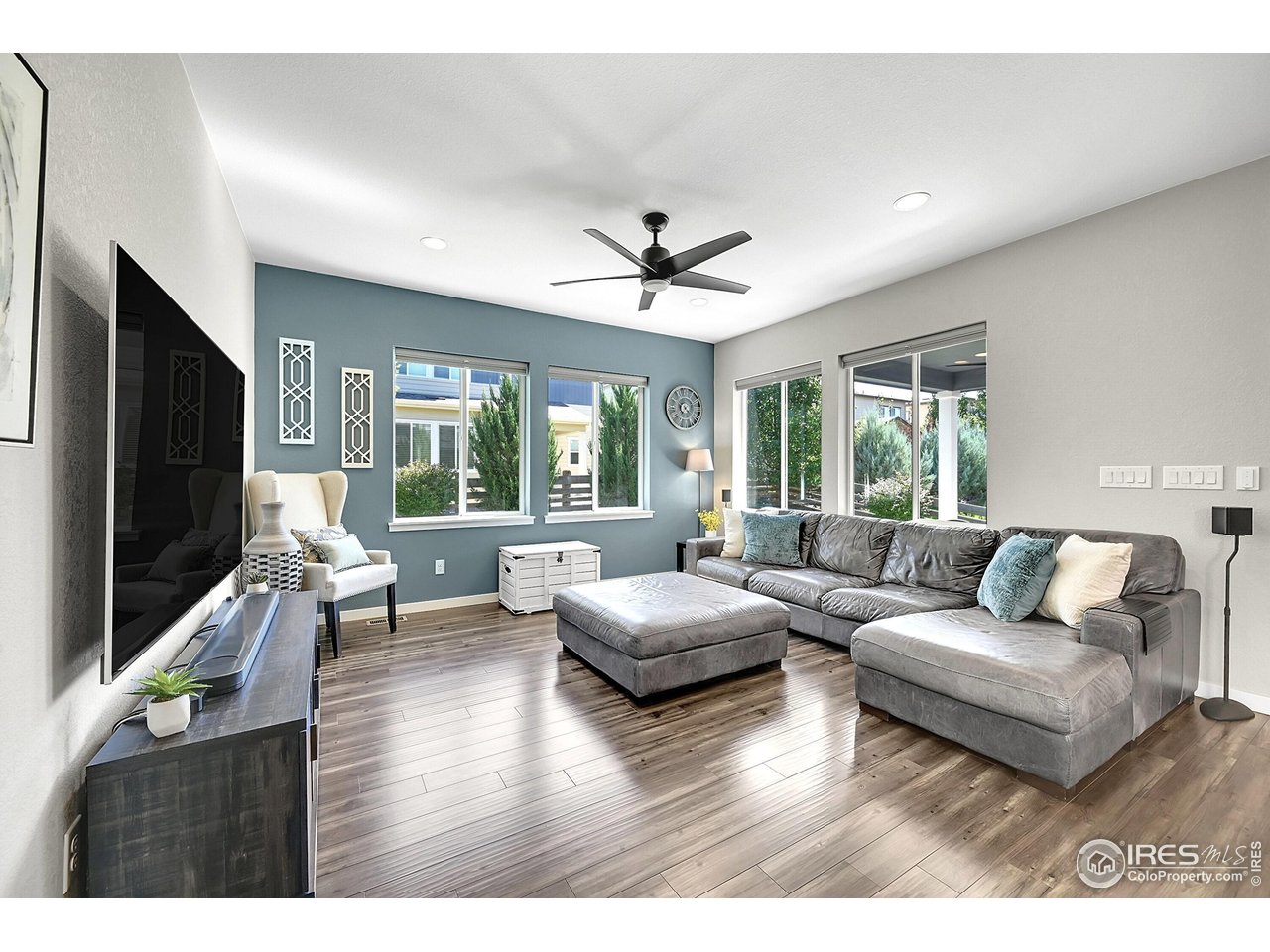68 Starlight Circle Erie, CO 80516 - Photo 14 of 50 a living room with furniture flat screen tv and a large window