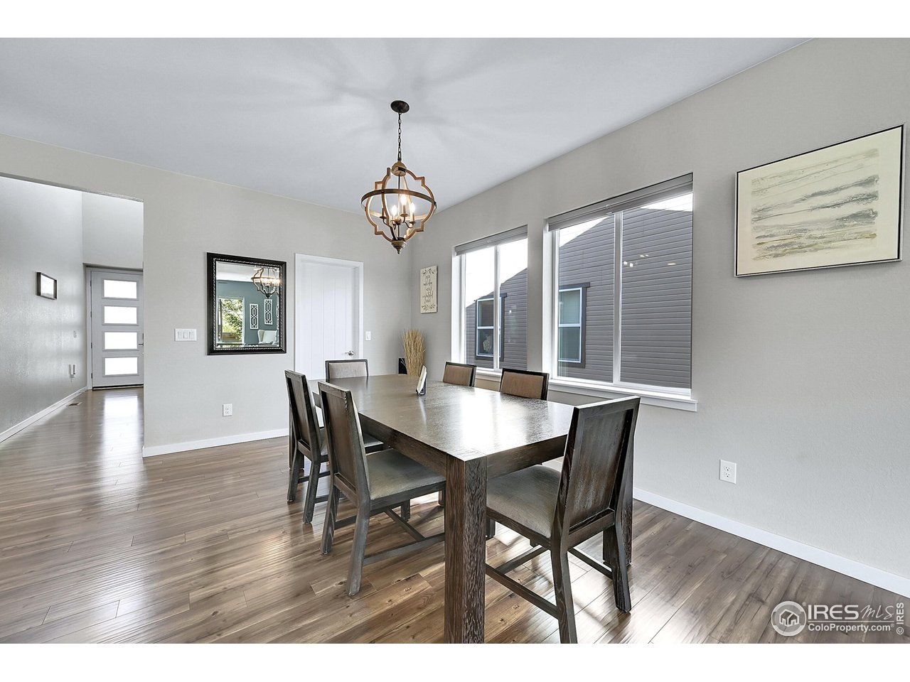 68 Starlight Circle Erie, CO 80516 - Photo 16 of 50 a view of a dining room with furniture wooden floor and chandelier