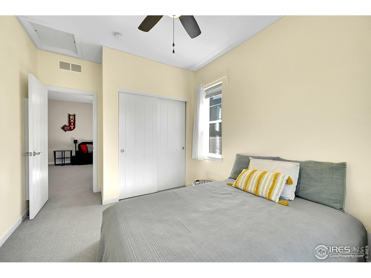 68 Starlight Circle Erie, CO 80516 - Photo 25 of 50 a bedroom with a bed and a chandelier