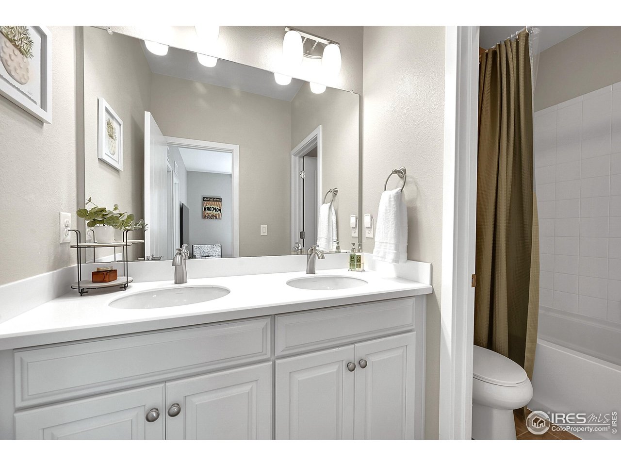 68 Starlight Circle Erie, CO 80516 - Photo 28 of 50 a bathroom with a sink and a mirror