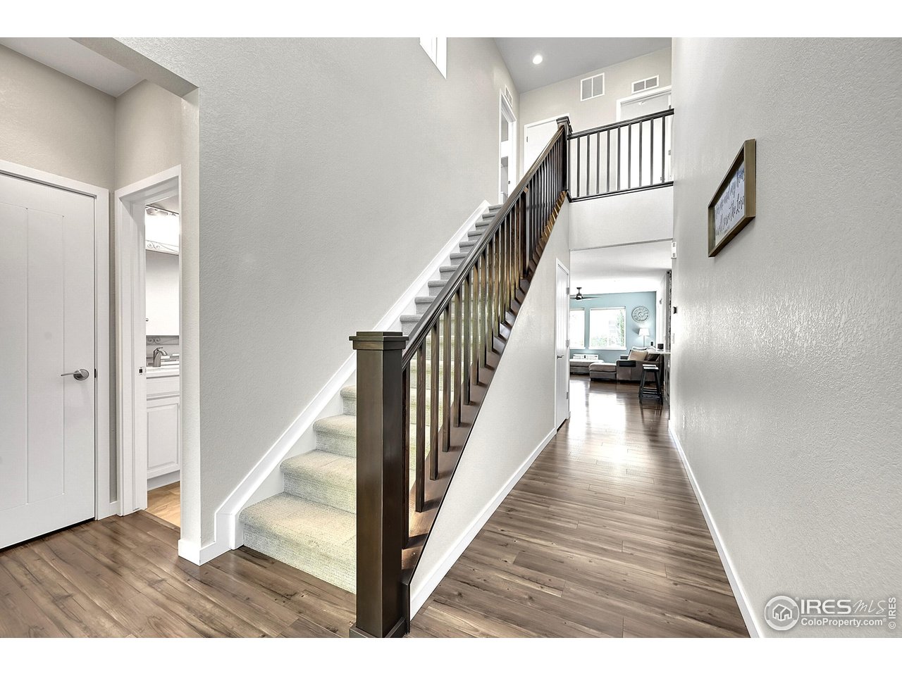 68 Starlight Circle Erie, CO 80516 - Photo 3 of 50 a view of entryway and hall with wooden floor