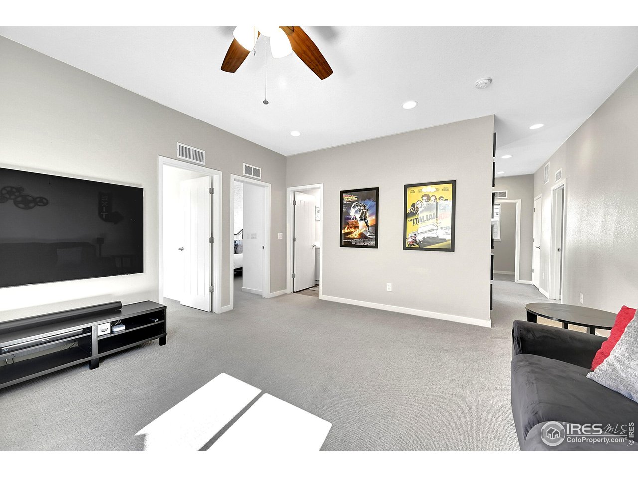 68 Starlight Circle Erie, CO 80516 - Photo 30 of 50 a living room with furniture and a flat screen tv