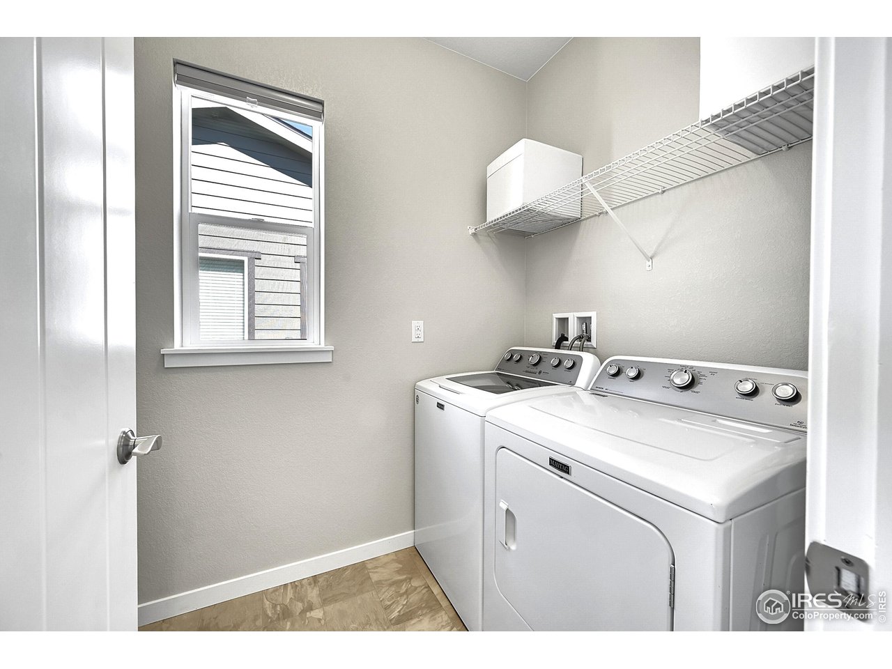 68 Starlight Circle Erie, CO 80516 - Photo 31 of 50 a utility room with dryer and washer