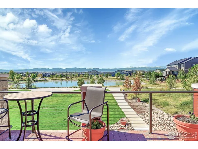 a view of swimming pool with outdoor seating and city view