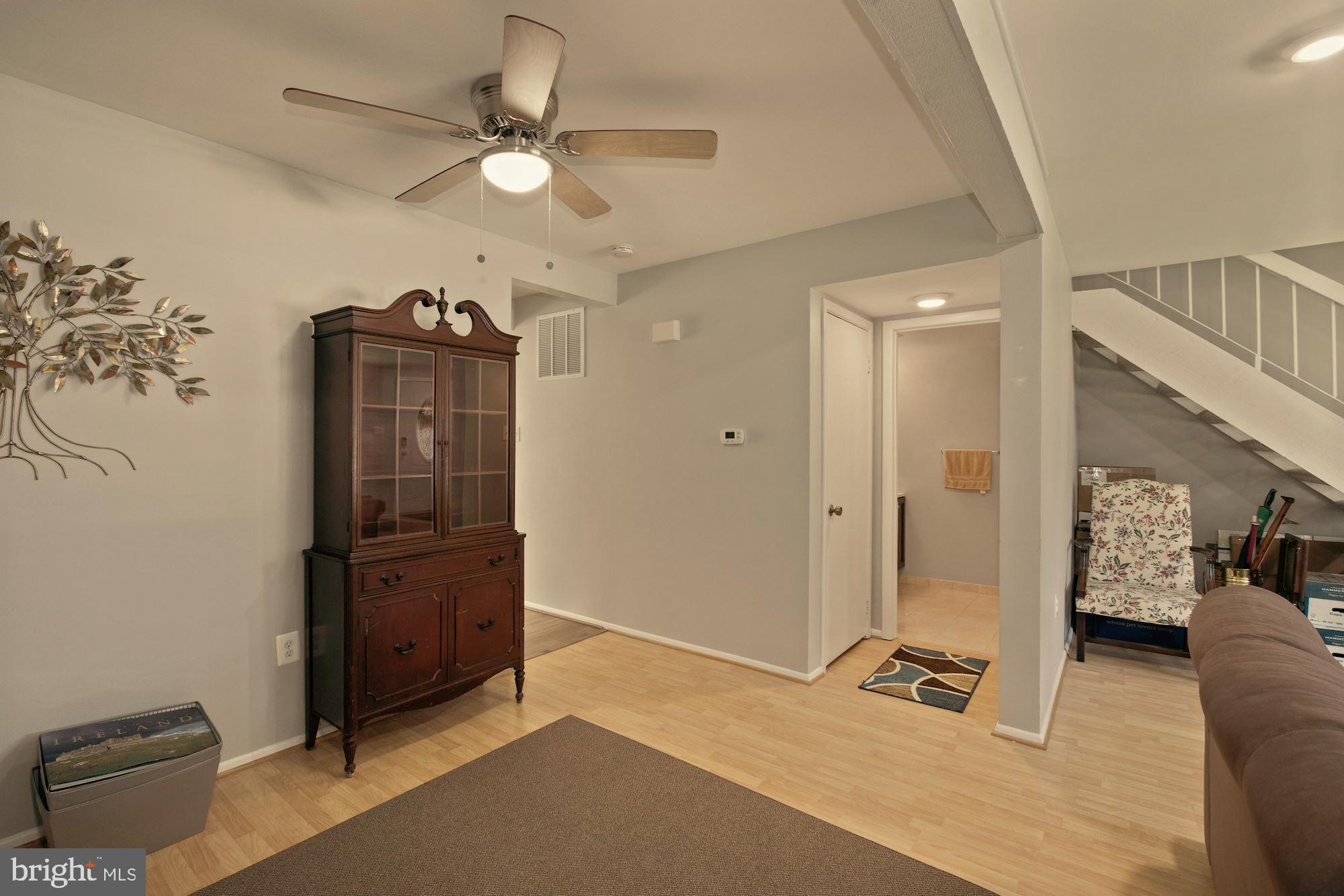 9122 Centerway Road Gaithersburg, MD 20879 - Photo 16 of 33 wooden floor in an empty room with a window
