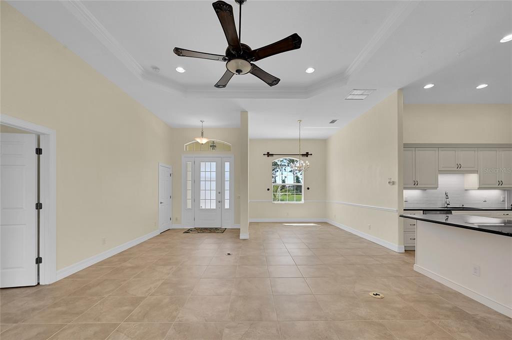 233 Fairway Road Rotonda West, FL 33947 - Photo 16 of 63 a view of a livingroom with a ceiling fan and window