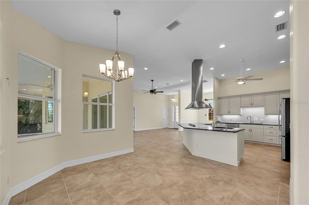 233 Fairway Road Rotonda West, FL 33947 - Photo 17 of 63 a view of a kitchen with a sink and refrigerator