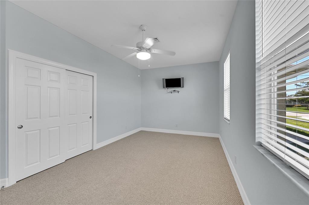 233 Fairway Road Rotonda West, FL 33947 - Photo 20 of 63 wooden floor in an empty room with a window